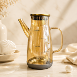 روغن‌ریز شیشه‌ای دودی ۶۰۰ میلی‌لیتر با زیره سیلیکونی و درب فلزی واشردار